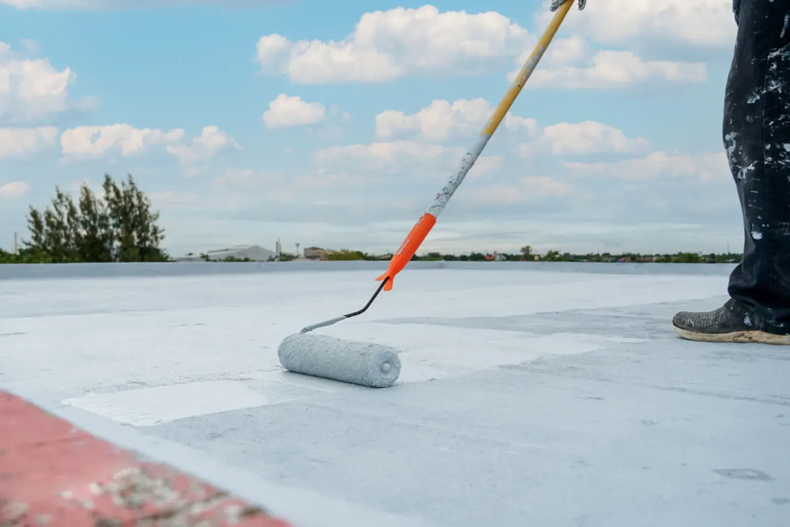 Roof coating service in progress. | S&S Remodeling