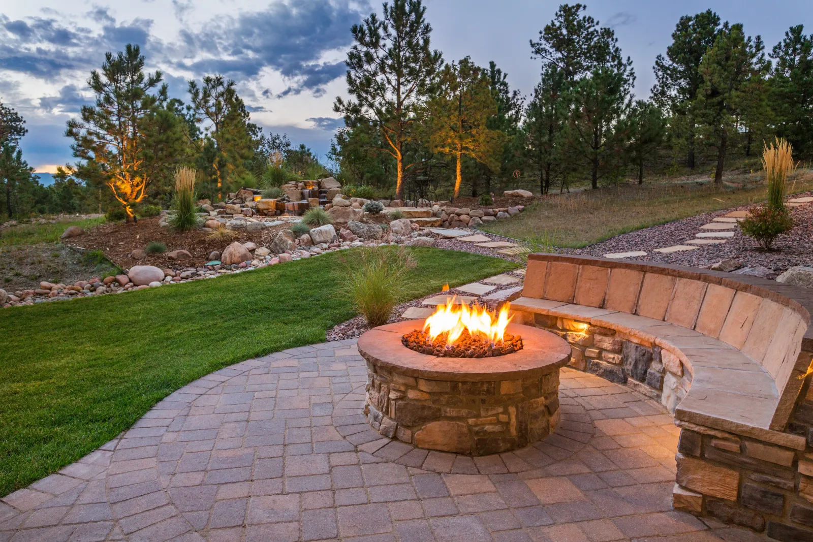 A stone patio installation in a residential outdoor living space. | S&S Remodeling