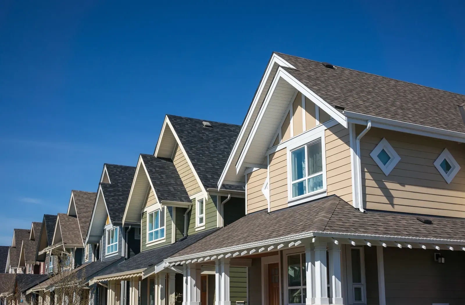 A new vinyl siding and asphalt roof replacement for a multi-family building. | S&S Remodeling