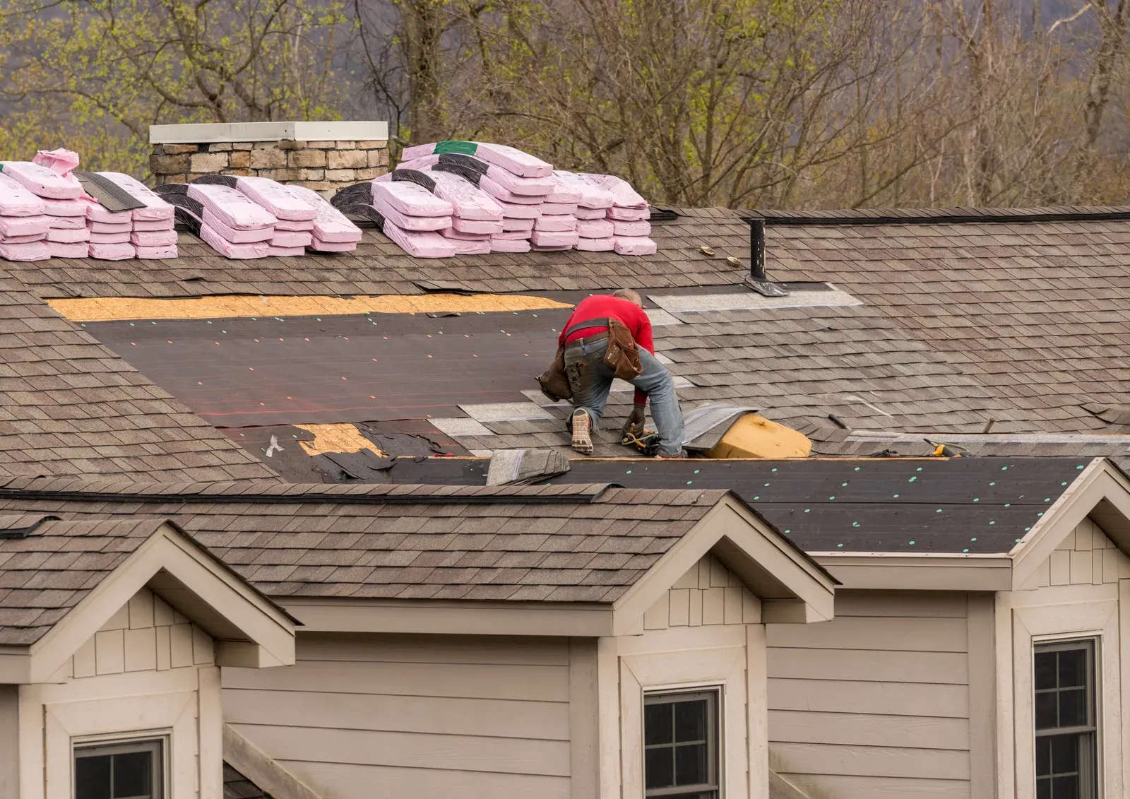 A newly installed asphalt roof on a multi-family building | S&S Remodeling