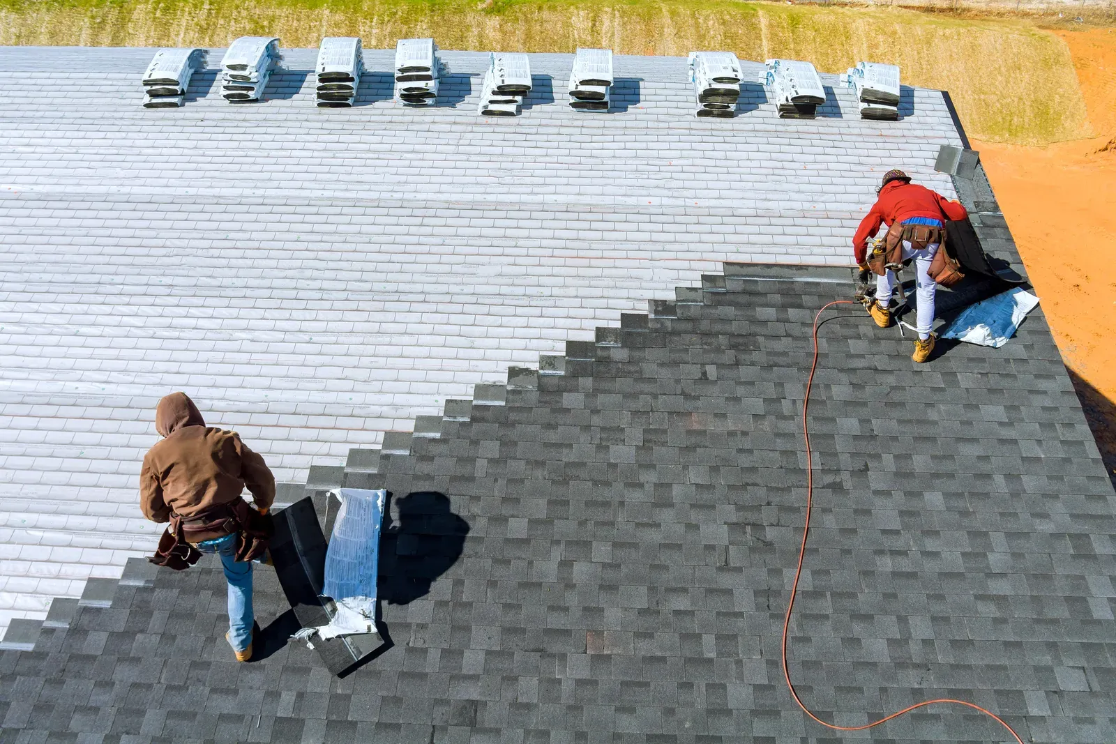 A residential roof being replaced with asphalt shingles. | S&S Remodeling