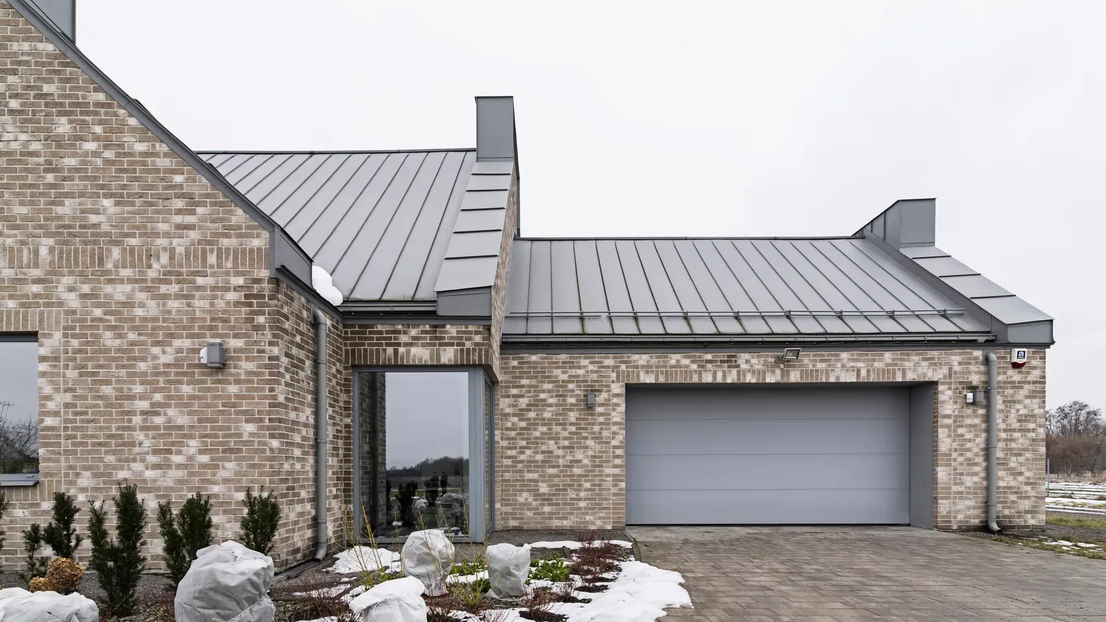 A new metal roof being installed on a residential building. | S&S Remodeling