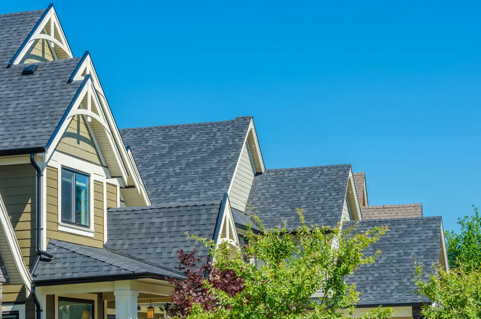 A new asphalt roof replacement for a multi-family building, hero-approved. | S&S Remodeling