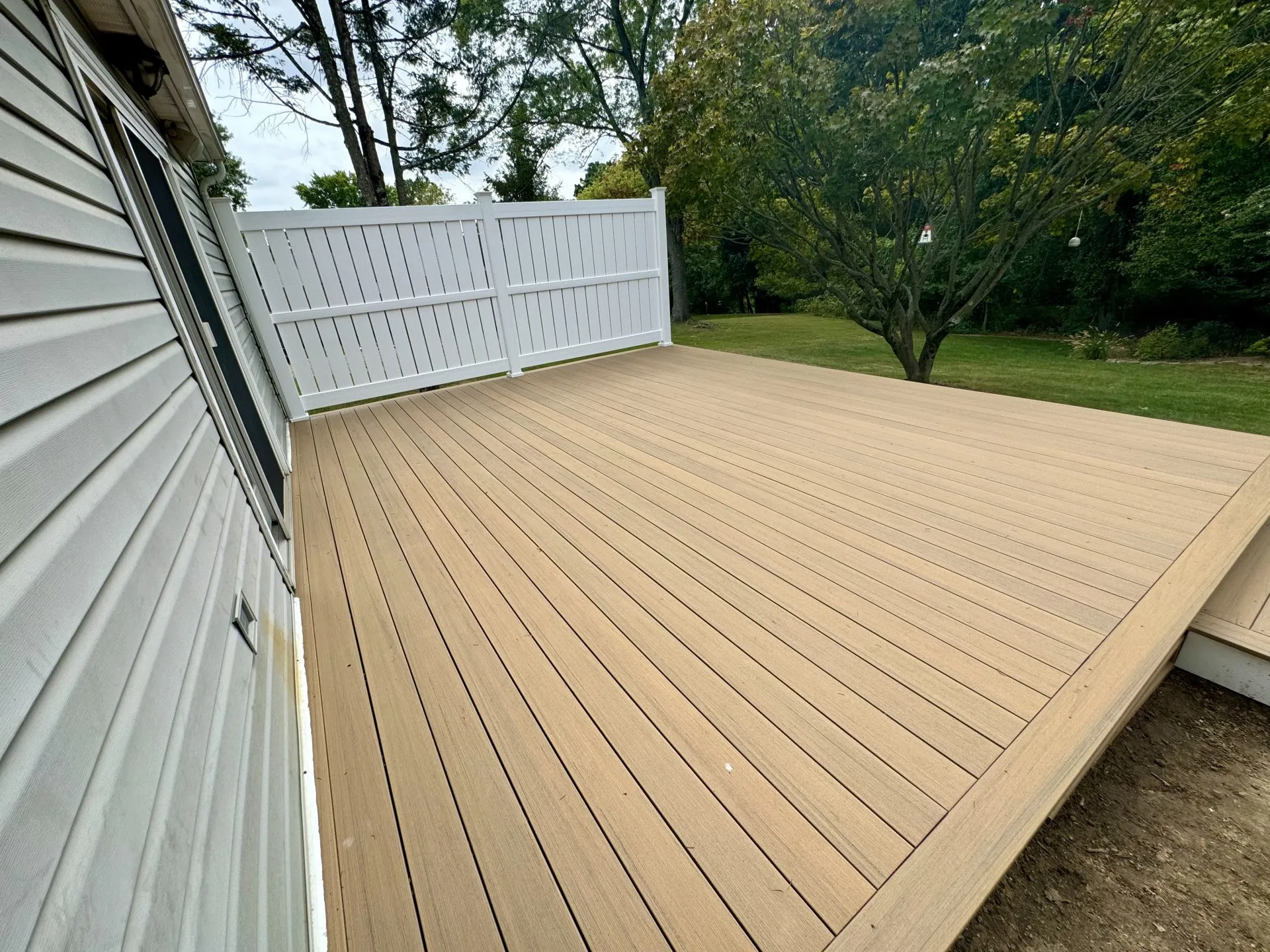 Revitalizing Outdoor Spaces with Deck Resurfacing and Privacy Fencing